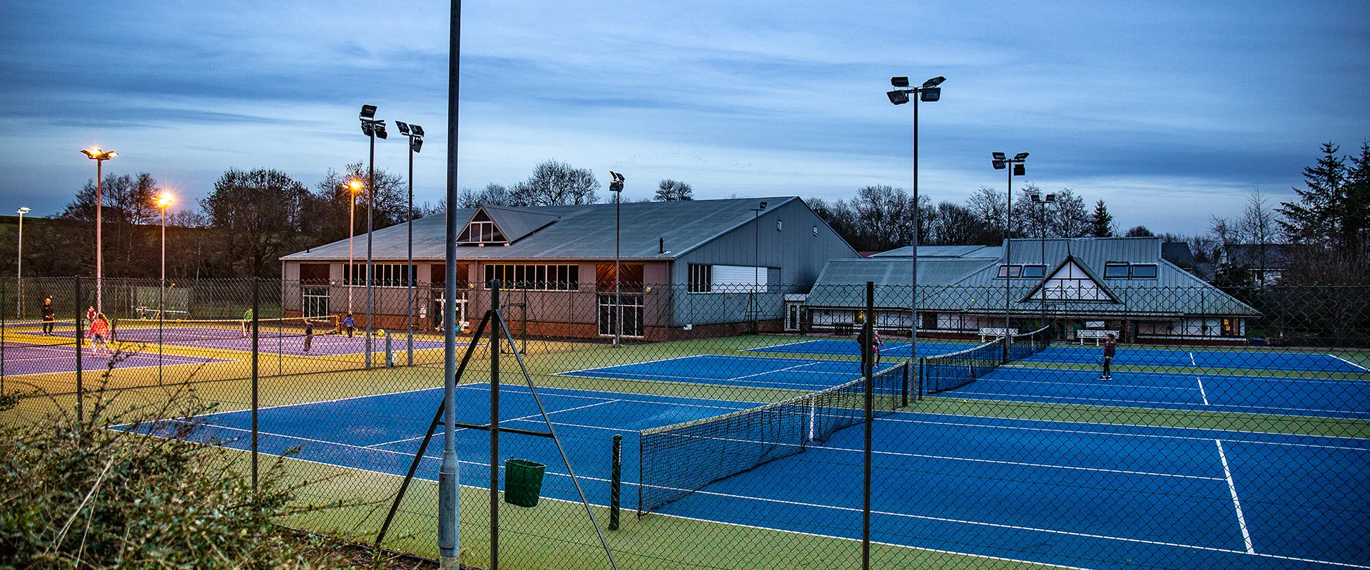 Members playing on Strathgryffe's outdoor tennis courts